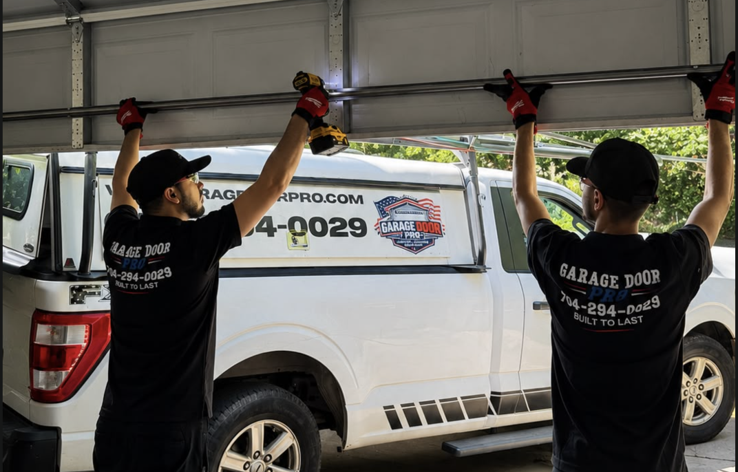 Garage Door Pro team installing new garage door panels - residential garage door installation Charlotte NC